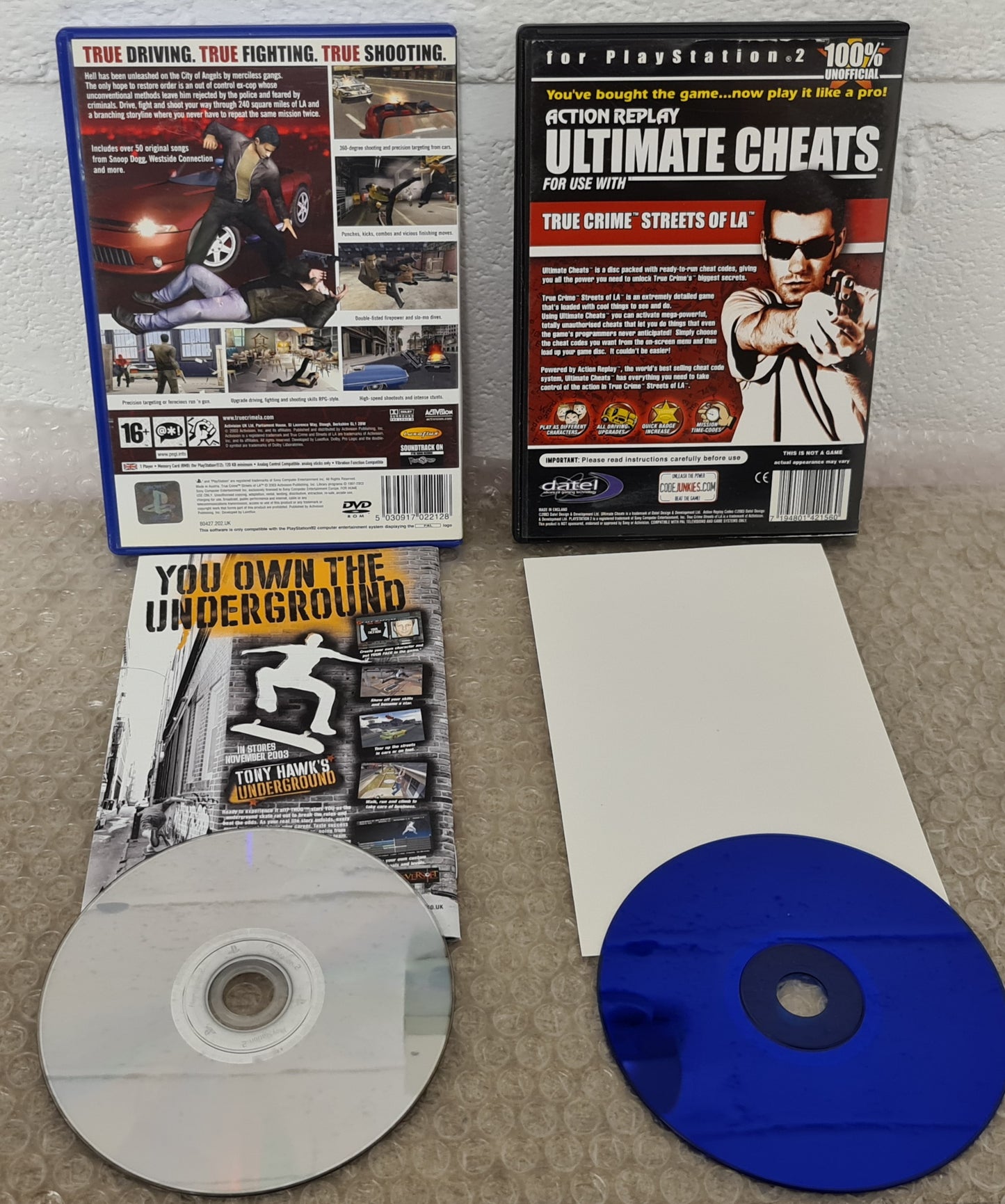 True Crime Streets of L.A & Action Replay Ultimate Cheats Sony Playstation 2 (PS2) Game & Cheat Disc