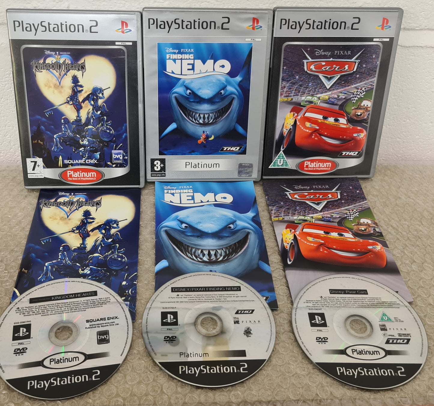 Disney's Kingdom Hearts, Finding Nemo & Cars Sony Playstation 2 (PS2) Game Bundle