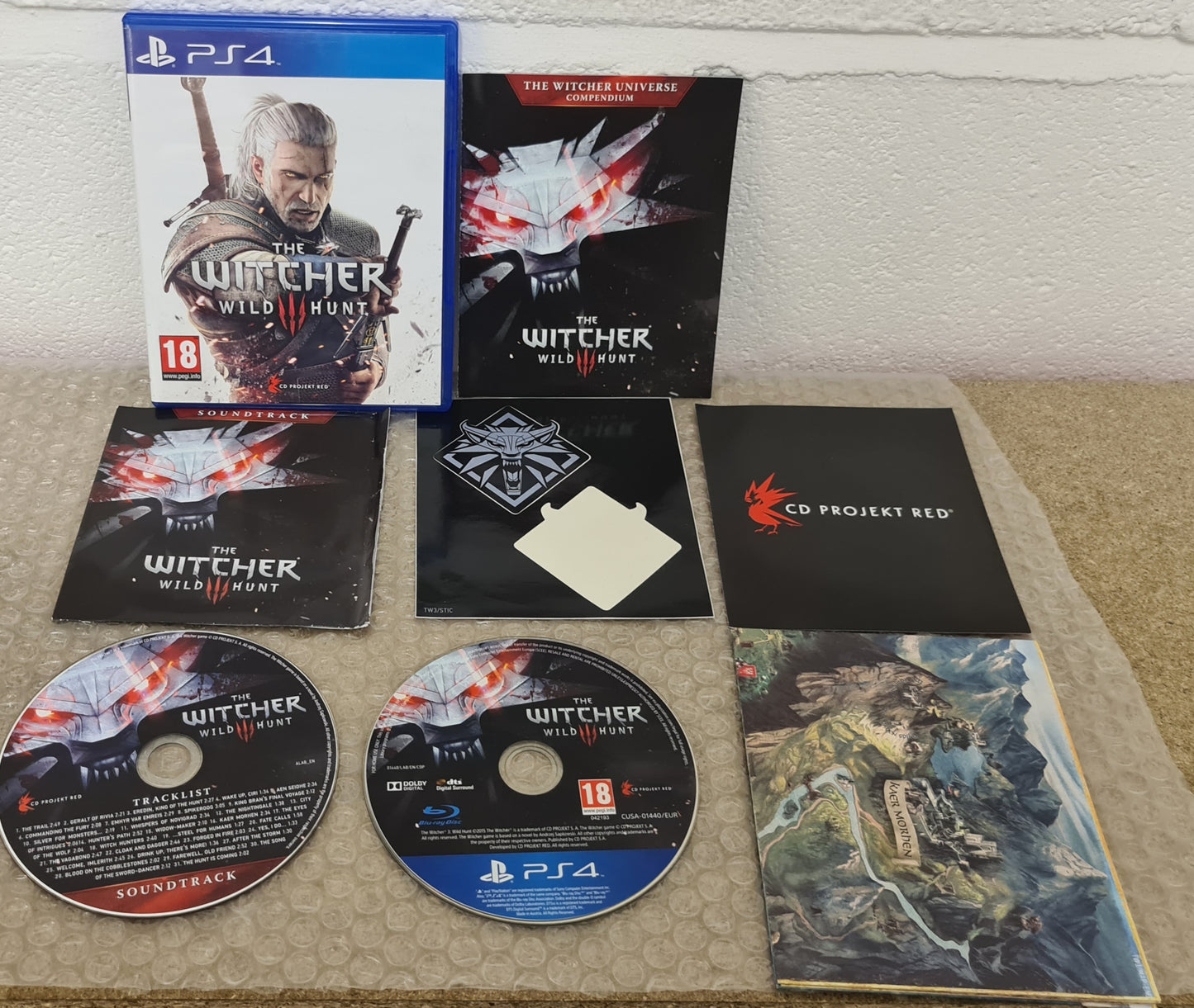 The Witcher 3 Wild Hunt with Map,  Soundtrack & Sticker Sony Playstation 4 (PS4) Game