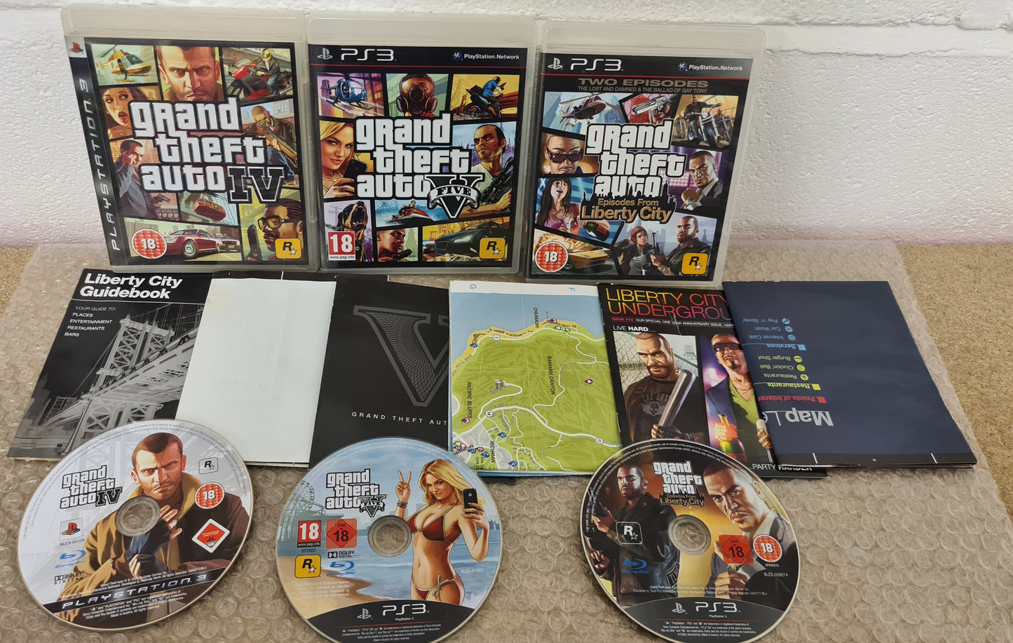 Grand Theft Auto 4, 5 & Episodes from Liberty City with Maps Sony Playstation 3 (PS3) Game Bundle